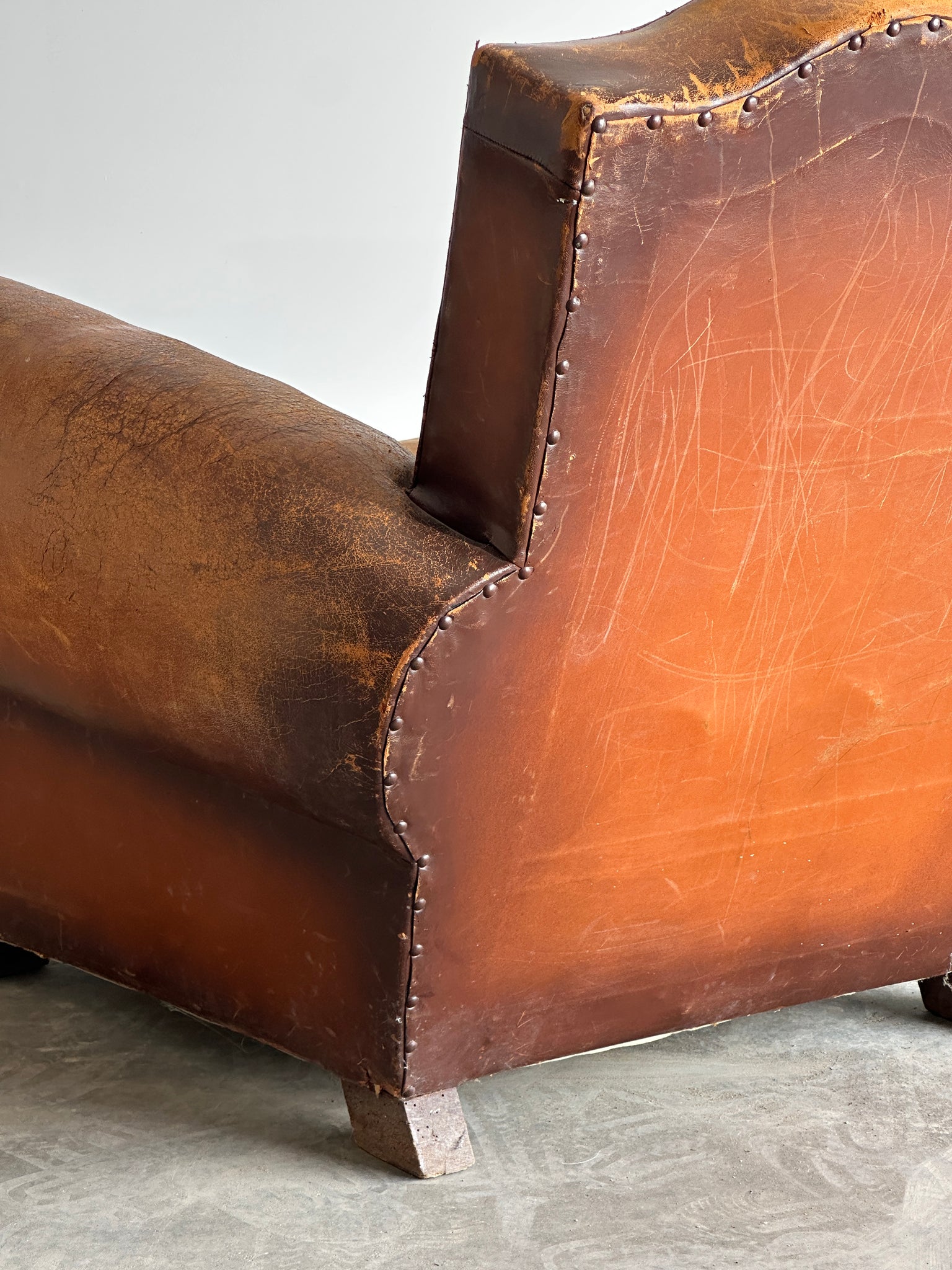 French art deco cognac leather and velvet moustache club chair