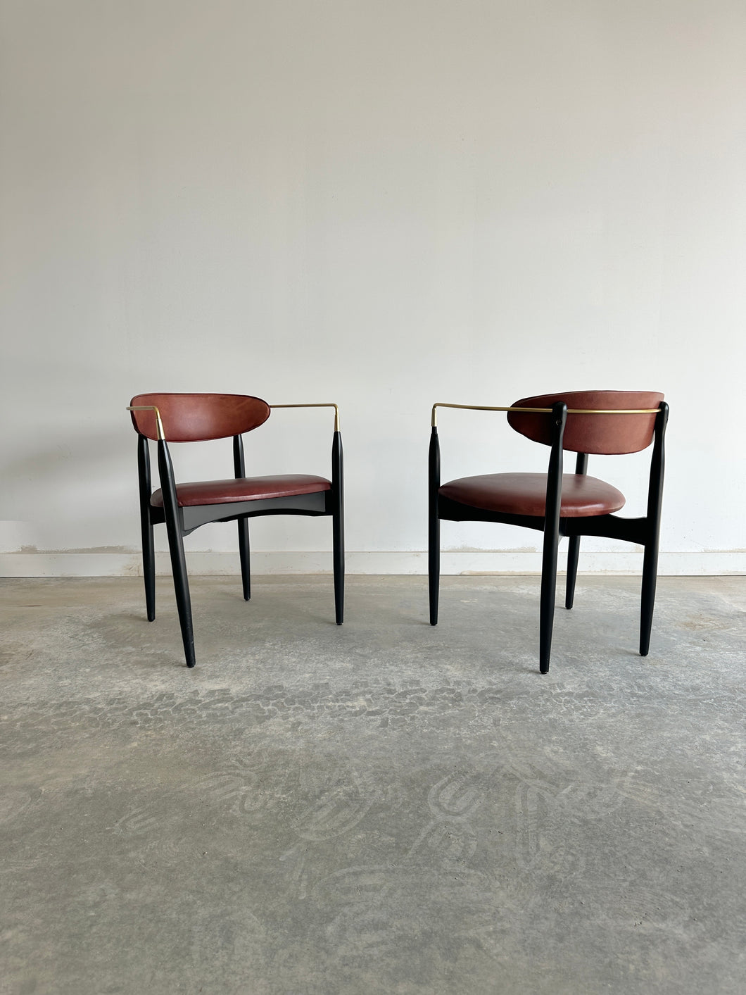 Deep red leather Viscount chairs by Dan Johnson